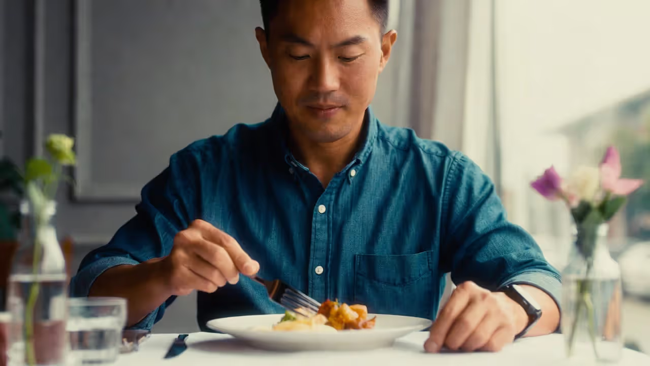 Person pausing and breathing before starting a meal.