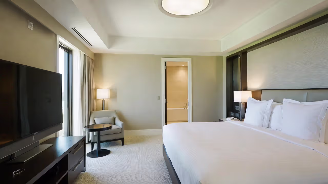 Private suite with en-suite bathroom at a luxury yoga retreat.